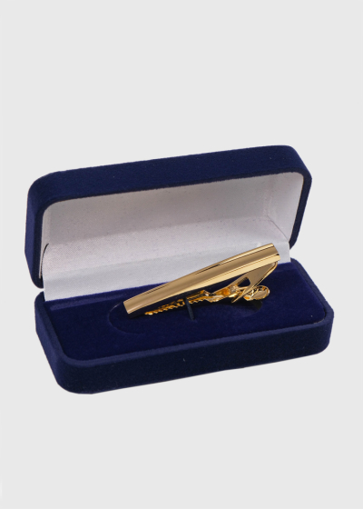 Gold-colored tie clip