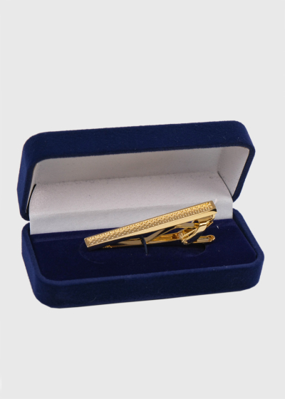 Gold-colored tie clip